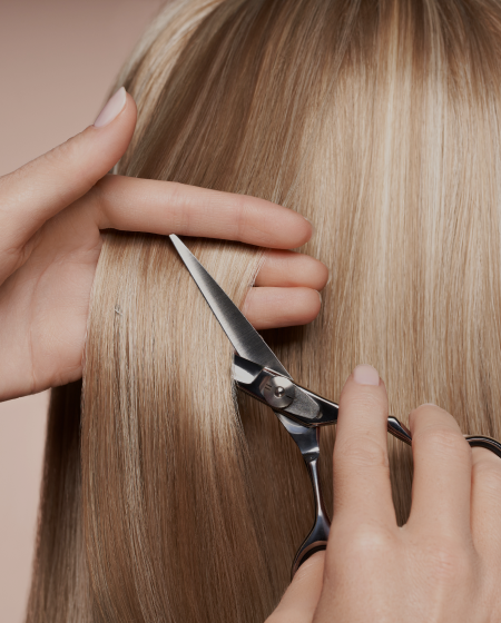 hairdresser-cuts-long-blonde-hair-with-scissors-4JV8ZRZ_1